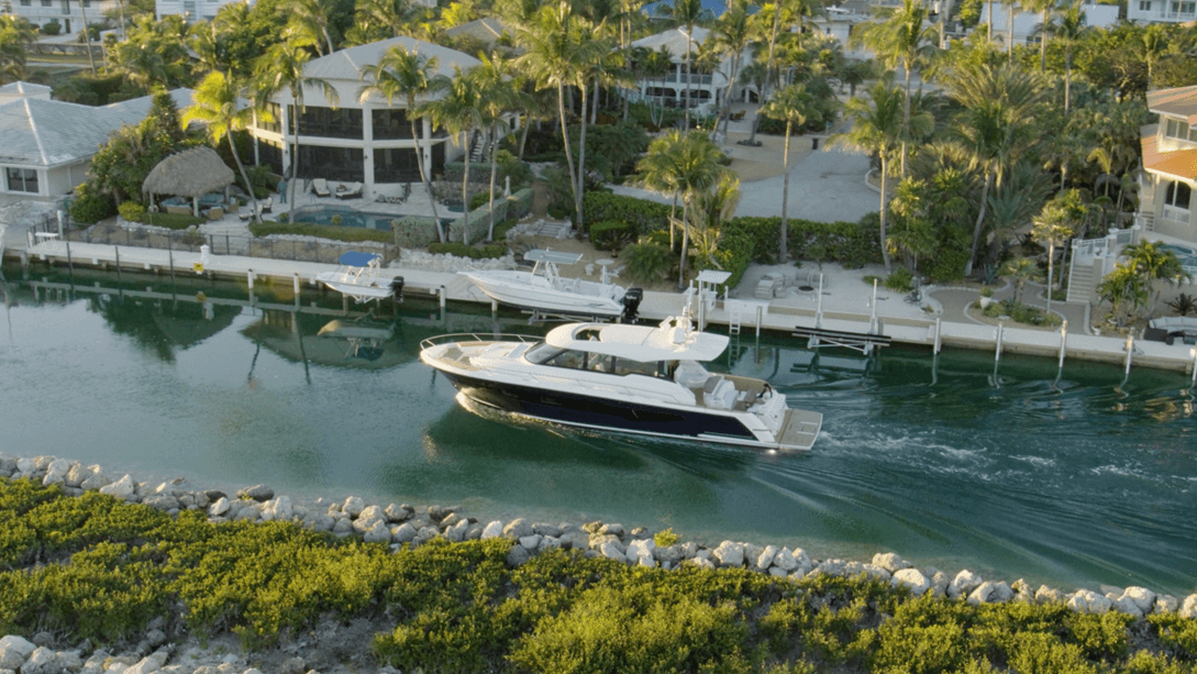 Tiara EX 60 cruising through canal