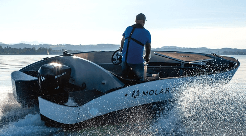 man driving formula 60 speedboat