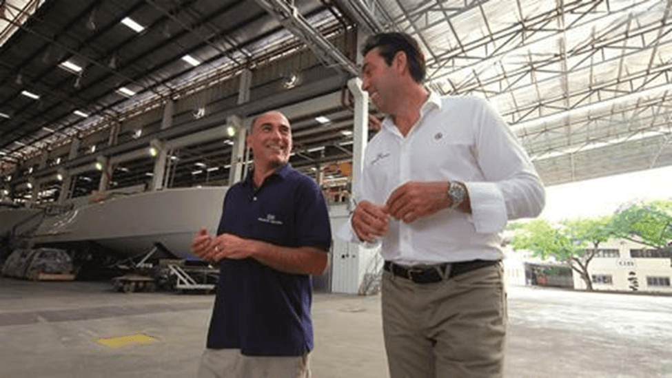 Mark Richards with Hank Compton, managing director of GB Marine Group. Grand Banks opened a new lamination facility earlier this year at its Malaysia facility