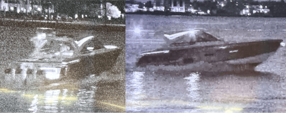 Two boats in the water at night