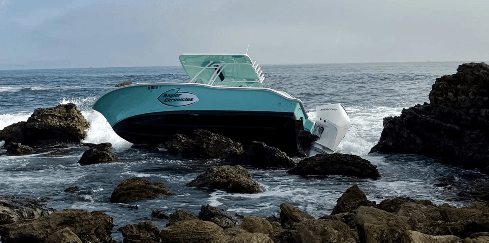A boat stuck in the rocks