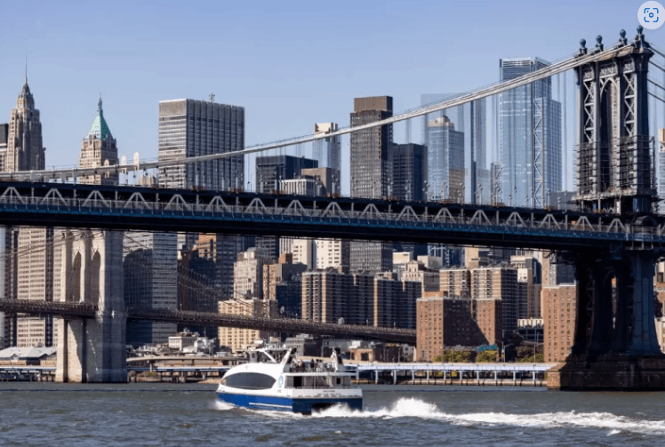 boat going under bridgr