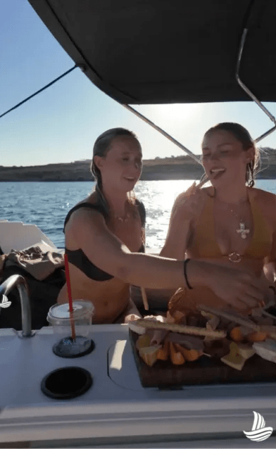 people eating snacks on a boat