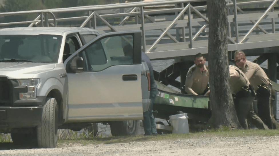 Cops putting a boat in a trailer
