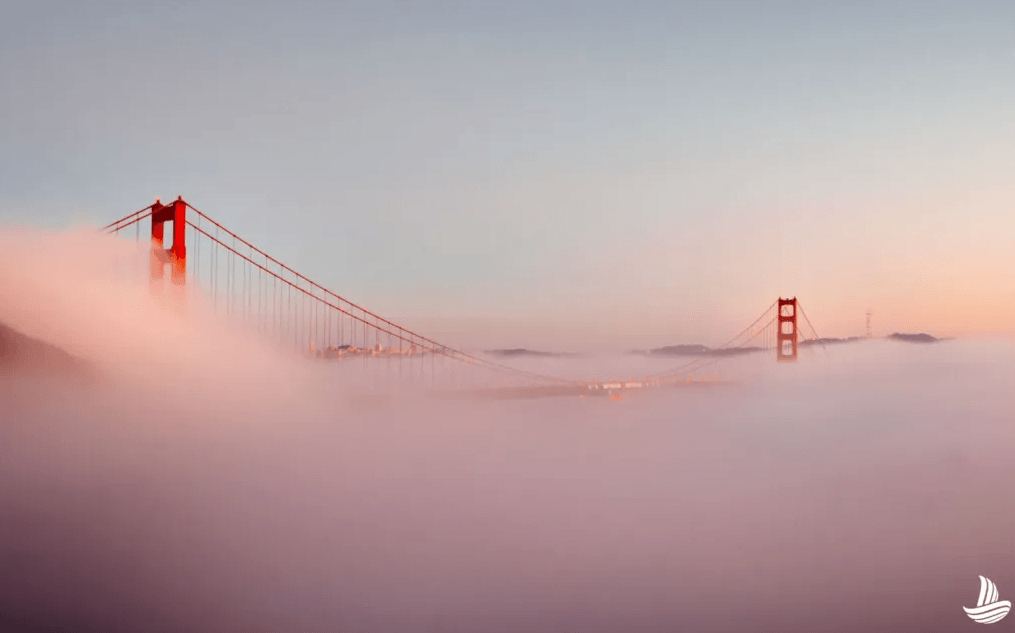 golden gate bridge peeking through fog