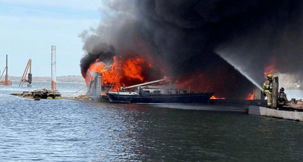 Sailboat on fire at the dock