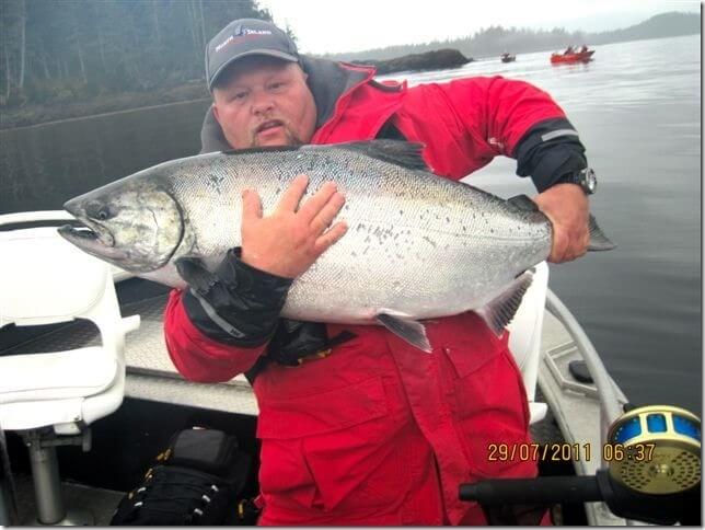 Man holding a large salmon