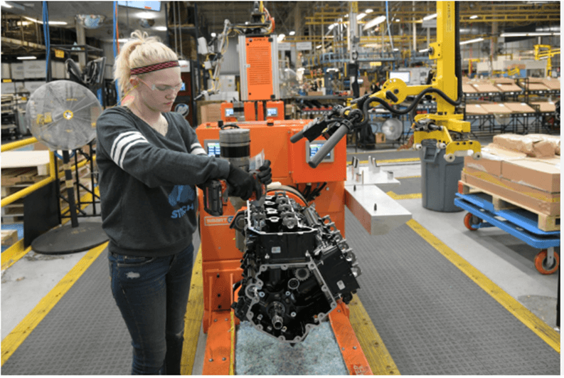 An outboard engine block begins the assembly process in Mercury’s factory