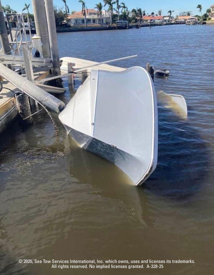 Boat turned on side in the water due to a hurricane