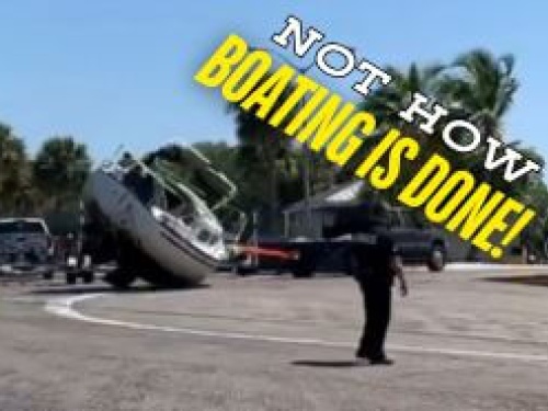 Truck pulling boat on its side