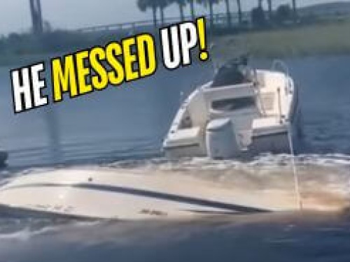 Boat sinking and being towed