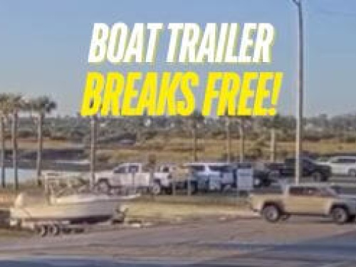 boat trailer breaks free near dock