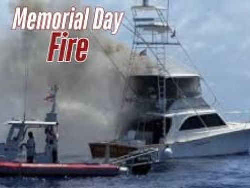 Boat with smoke coming off it from a fire