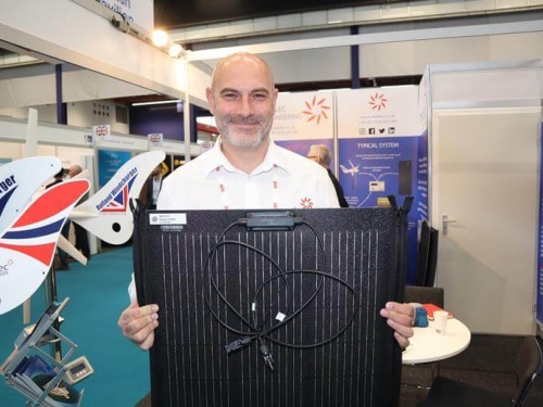 Sales Manager Stuart James holds one of the new Spectra Zipperflex 100W solar panels
