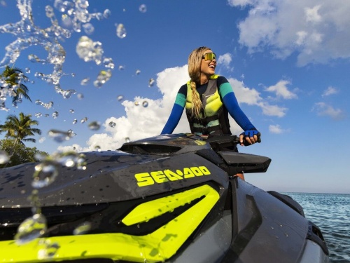 Woman on a PWC with a large smile