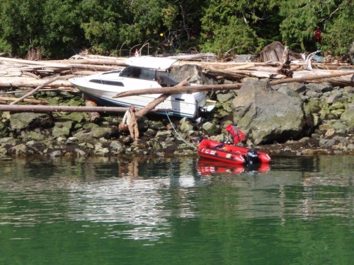 Boat on land atop rocks
