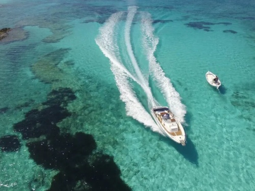 boat cruising in blue waters