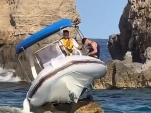 boat stuck on a rock
