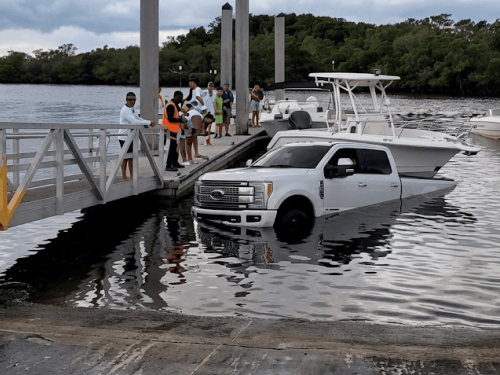 Truck and Boat sinking at boat dock