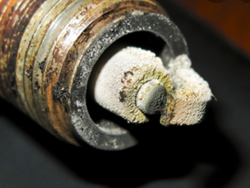 fouled spark plug, carbon buildup on a spark plug