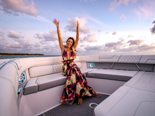 woman on a boat, woman waving on a boat