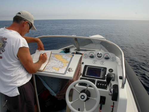using a boating chart, reviewing course on a boating chart
