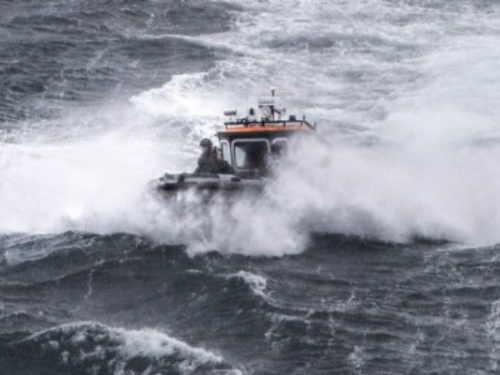 Boat in rough water, big waves