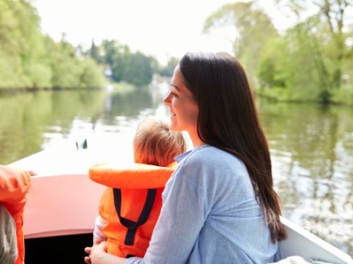 Baby with life jacket on a boat
