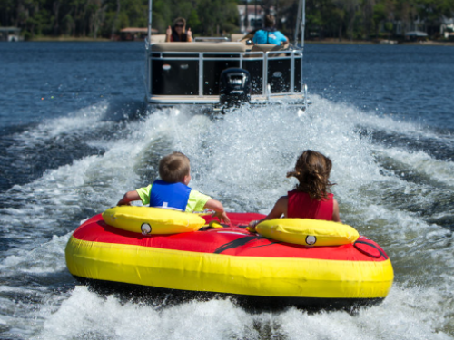 Kids tubing on the water