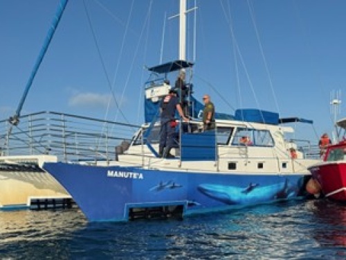 Catamaran being rescued