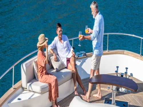 3 people relaxing on yacht