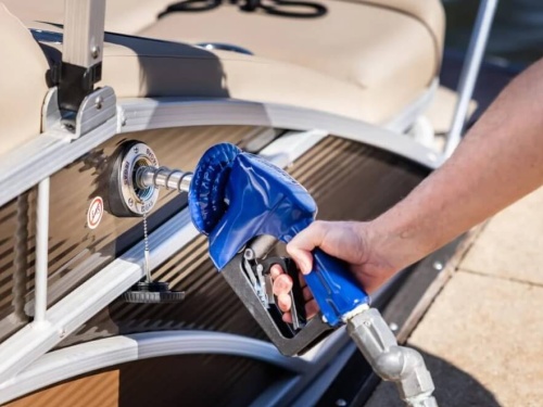 Person fueling up their boat with fuel