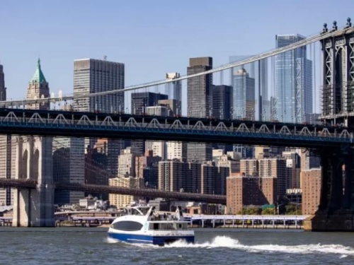 Boat going under bridge