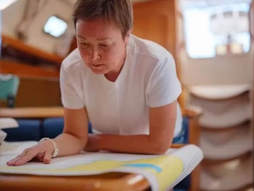 woman looking at paper charts